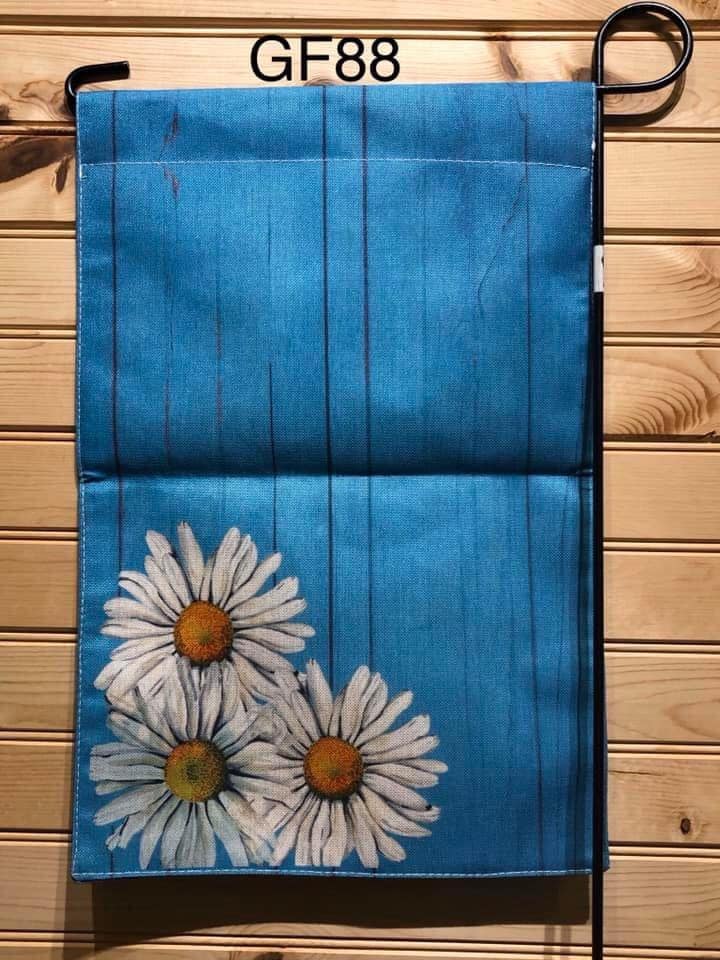 Garden Flag - GF88 - Blue Wood wall with Daisies in Corner on Wheat