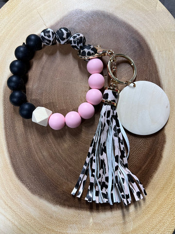 Silicone Black / Pink / Cow with Pink Cow Tassel and Wood Disc Bracelet Keyring.
