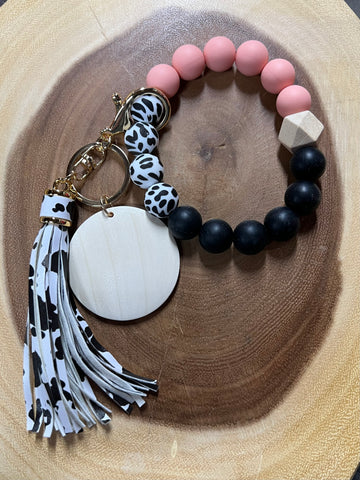 Silicone Black / Coral / Cow with Cow Tassel and Wood Disc Bracelet Keyring.
